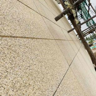 黑龙江 黄金麻花岗岩荔枝面外墙干挂石材效果示例